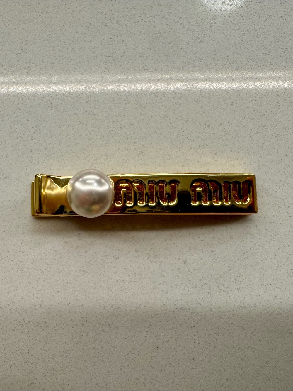 Miu Miu Gold-Plated Hair Clip with Single Pearl Accent